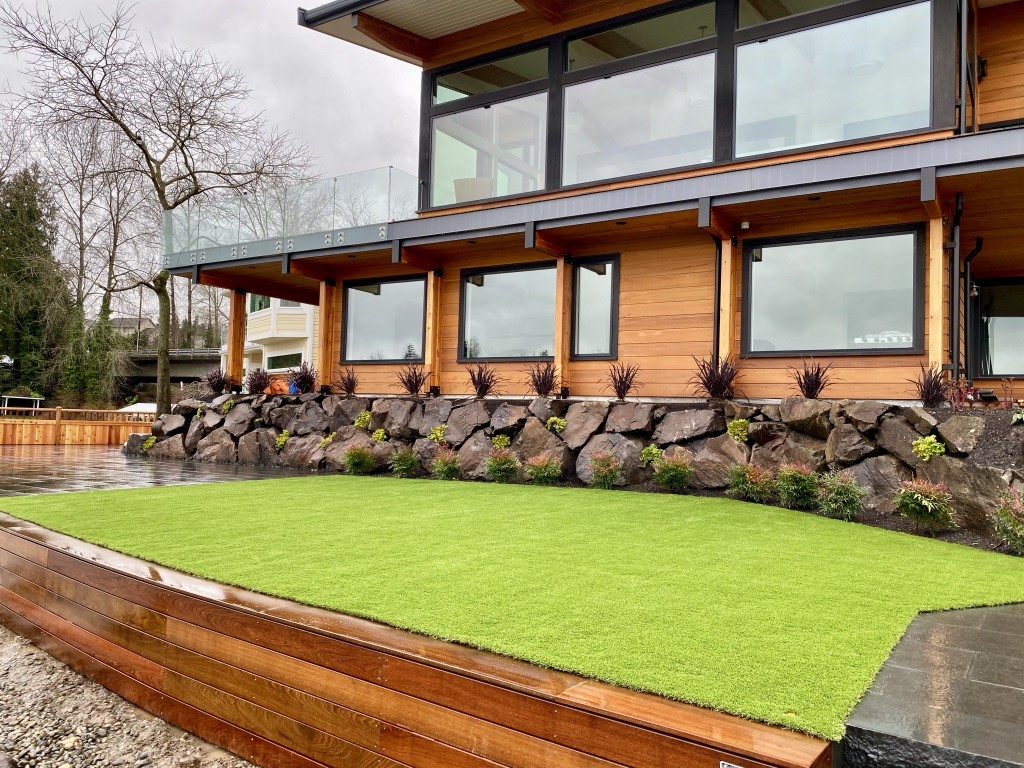 Lake Stevens shoreline lawn, rockery, and wood terrace